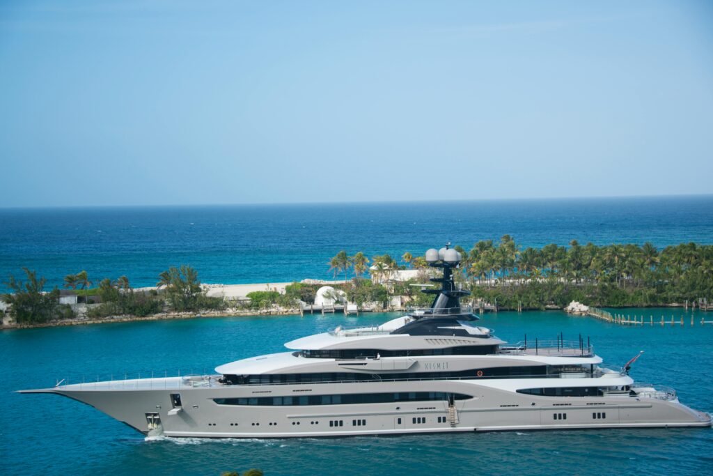 White and Blue Yacht on Body of Water